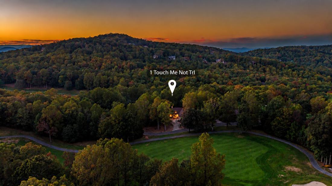 Dusk aerial, the home above the fairway (location marked)