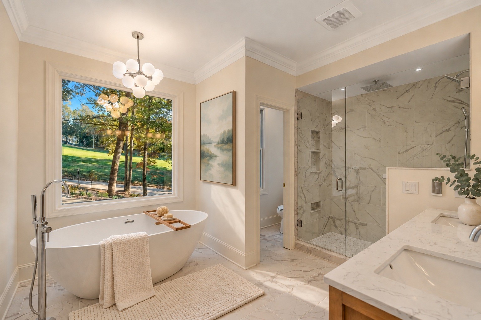 Freestanding tub beneath a picture window looking onto the fairway
